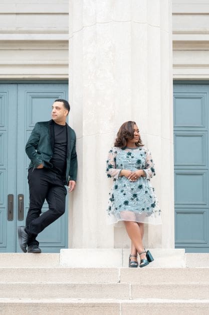 Shontae and Eric Buffington on steps looking away wearing a hand sewn green dress Simplicity 8545
