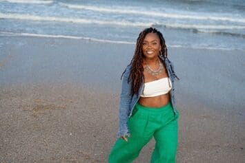 Black women standing on the sandy beach barefoot wearing kelly green simplicity 9235 pants