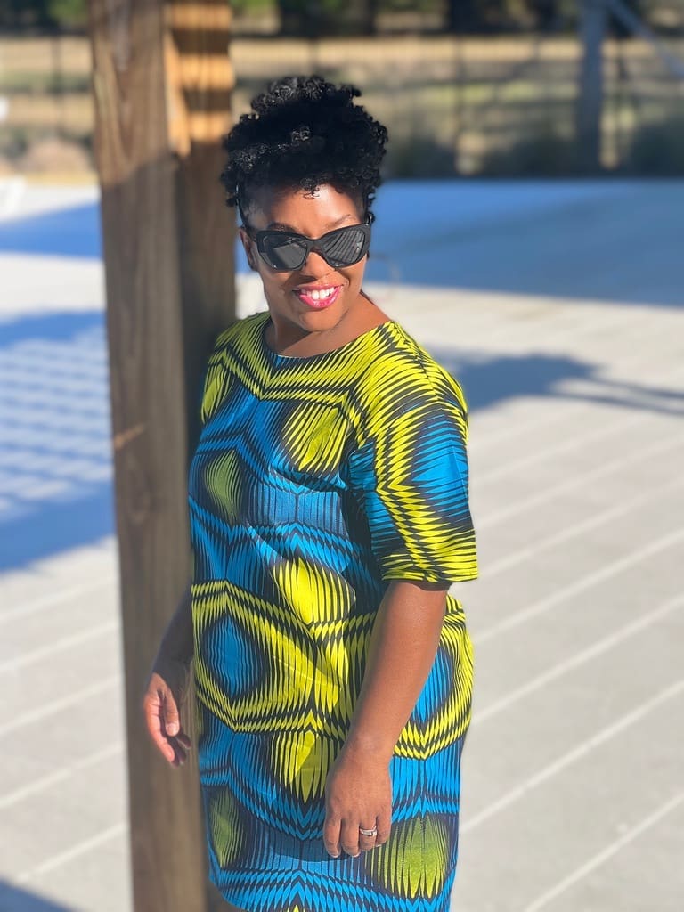 African American woman wearing Blue and yellow ankara Mccalls 8160 shift dress